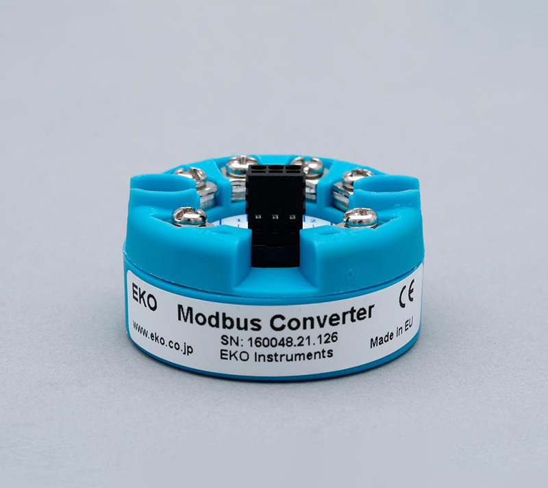 MC-20 Modbus signal converter in a round blue housing with terminal connectors.